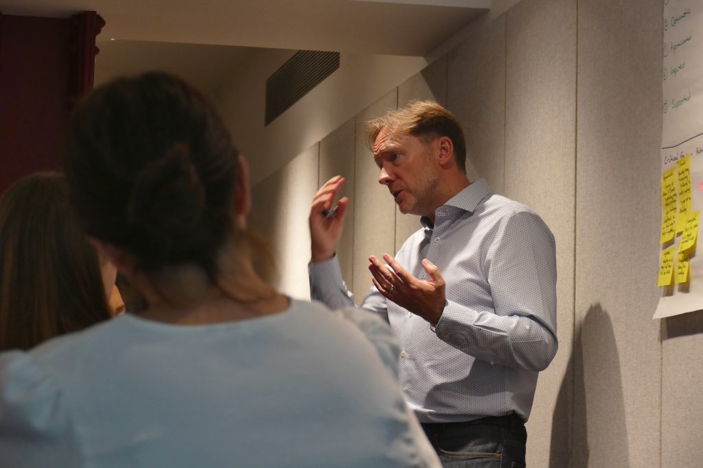 Picture of Joss Mathieson facilitating a team workshop